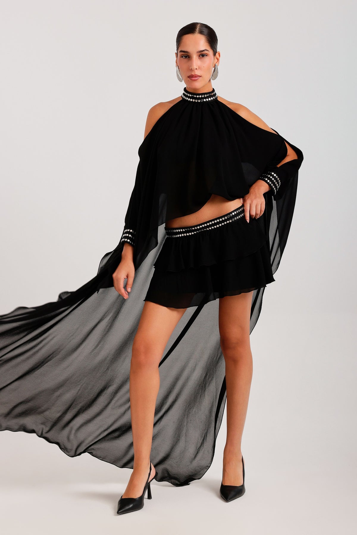 Black set — cape in movement